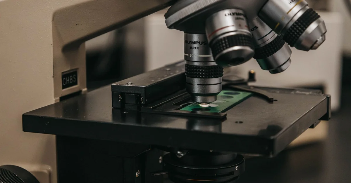 Detailed view of a laboratory microscope, essential for scientific research and analysis.