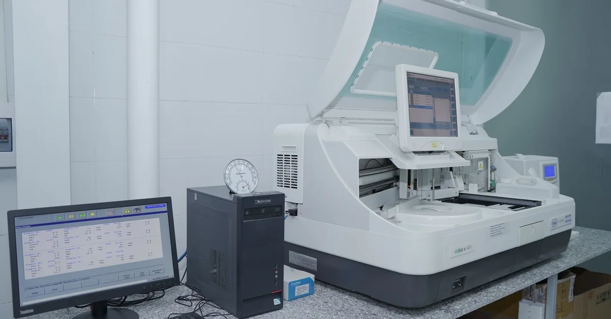 High-tech laboratory equipment with computer system in lab setting.